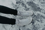 a pair of feet in white socks