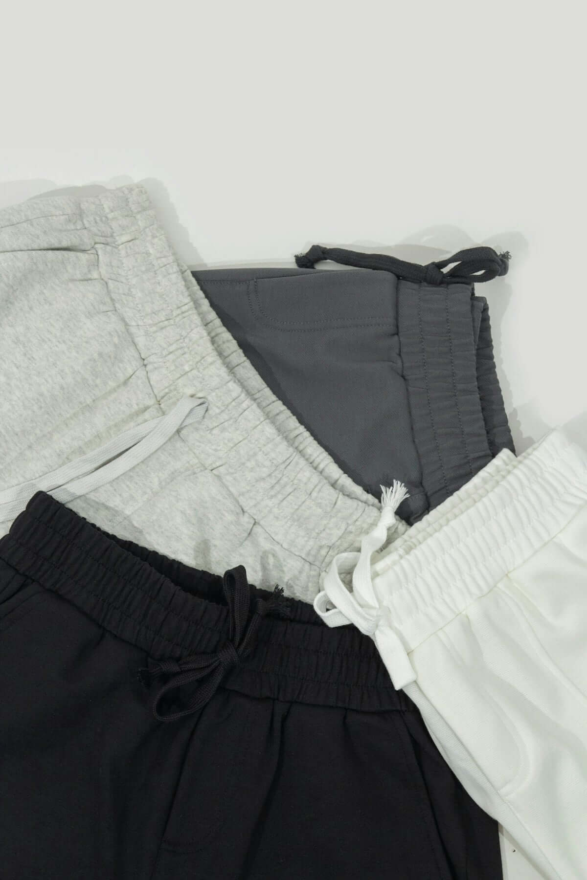 A group of three shorts sitting next to each other
