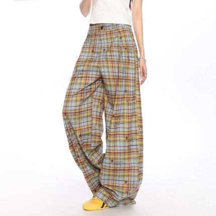 Pantalón casual a cuadros de corte holgado para mujer en tonos amarillos y azules, confeccionado en poliéster.