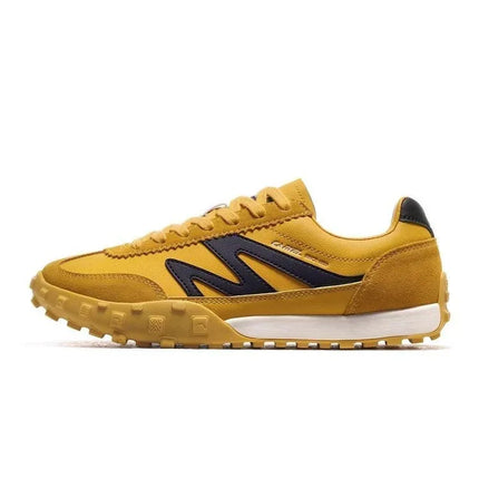 Zapatillas Urban amarillas de cuero y tela con punta redonda en contraste negra estilo casual