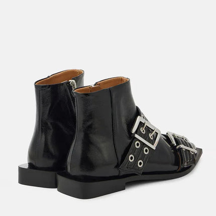 Botas Stilletto negras de cuero con hebillas metálicas y tacón medio estilo moderno