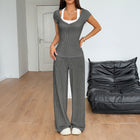 Conjunto deportivo mujer: chaleco y pantalones rectos gris
